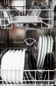 Dishes in a modern dishwasher machine