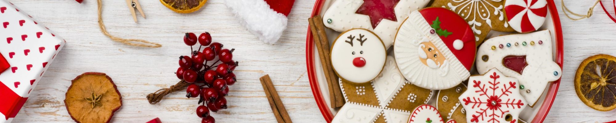 Traditional christmas gingerbread, toys and decor isolated on wooden background Traditional christmas gingerbread, toys and decor isolated on wooden background